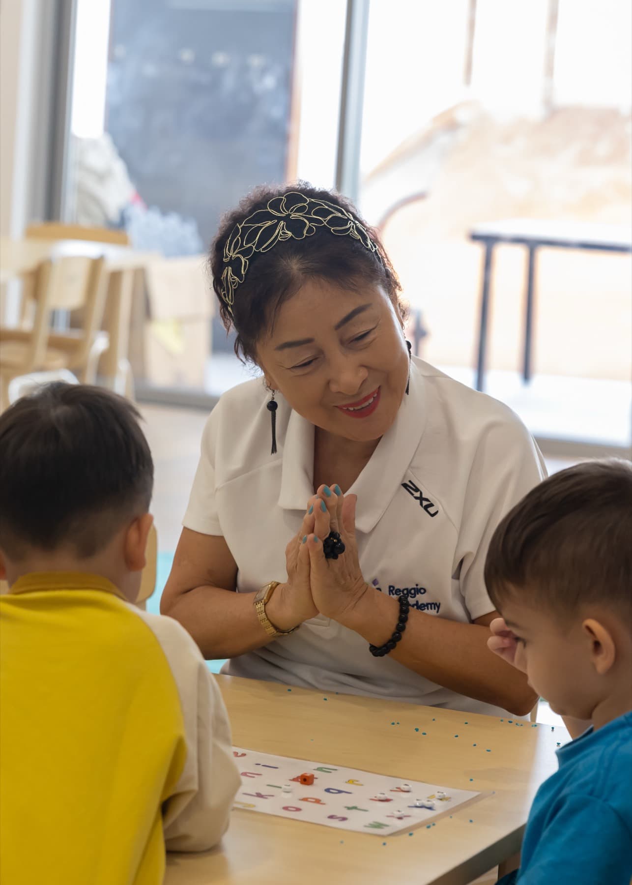 An educator working with children at a table